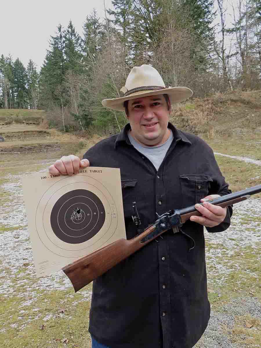 John proudly showing a 100-yard target scoring 50-X.